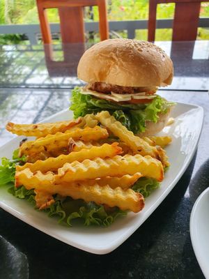 Mushroom 🍄 Burger 🍔 😋 with potatoes 🥔 at Veggie Café - Galaxy Star Angkor Hotel in Siem Reap