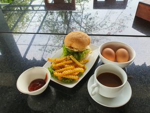 Breakfast set: Crispy mushroom Burger, coffee and half boiled eggs for just USD 3.00 at Veggie Café - Galaxy Star Angkor Hotel in Siem Reap