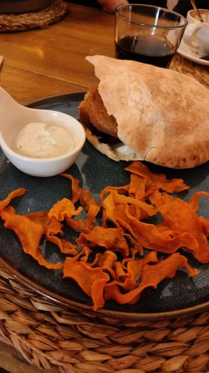 Falafel Pita Sandwich with sweet potato fries and dip at Balino Yoga Café  in Sevilla