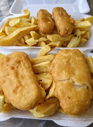Battered vegan sausages and fish, with fresh chips at The Front Fish and Chips in Newbiggin-by-the-sea
