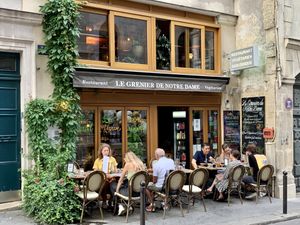 A brass band played across the street when we dined, so we had a show with our outdoor dinner.   at Le Grenier de Notre Dame in Paris