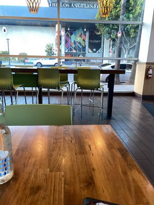 Tall Seating and Booth Style in Back  at Next Level Veggie Grill - The Dome in Hollywood