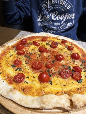 Veganized Margarita. Looks boring, but actually it's not. Thin crispy dough and mouthwatering sauce with fresh garlic make magic things. at Jean's Bistro in Yerevan