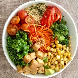 Buddha bowl - tofu, kale, roasted curried chickpeas, carrots, quinoa, tomatoes and peppers with a light peanut sauce at Quinoa in Las Condes