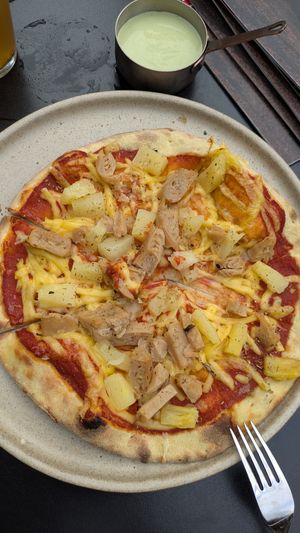 Pizza Hawaii with vegan cheese and vegan chicken at Mamma Kitchen Stories in Kaunas