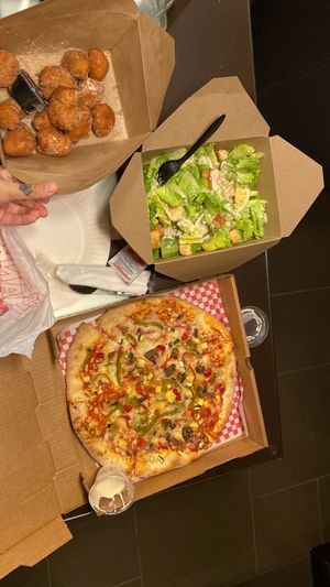 Vegan pizza, vegan zepolli’s (doughnuts) and vegan Caesar salad   at Slice of Vegas Pizza in Las Vegas