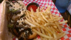 Vegan Portabello Cheesesteak, with rosemary garlic fries. at Slice of Vegas Pizza in Las Vegas