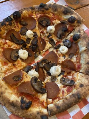 Pepperoni and mushroom pizza with cashew cheese    at Vegan Pizza Land in Easthampton