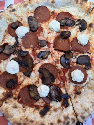 pepperoni, mushroom, and housemade "ricotta" pizzaa  at Vegan Pizza Land in Easthampton