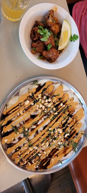 Fried cauliflower and carpaccio dishes. at Maslow in Paris
