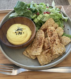 Sliced tempeh with vegan cheese and salad  at Yu Dei 余地 in Kowloon