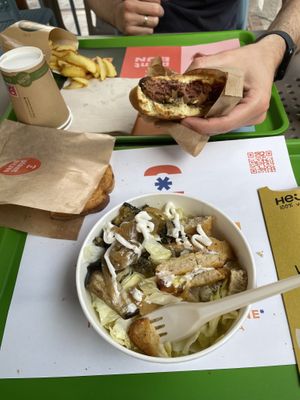 Sea salad (near) and ‘bacon’ burger meal (far)  at Plant Bun in Turin