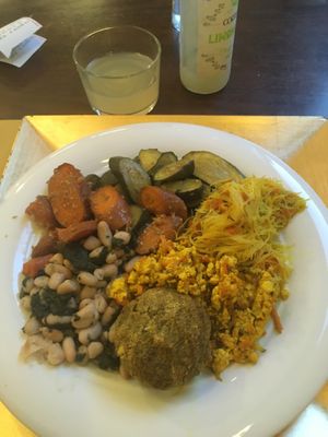 A choice in the buffet, veggies, rice noodle and scramble tofu at Cibó Vegan Food in Milan