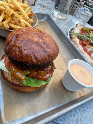 Food from outside bar: black bean burger with Vegan, Suraci, mayonnaise and fries at Blique by Nobis in Stockholm