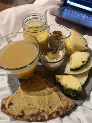 My breakfast, consisting of ginger, shots, mango, soya milk, smoothie, overnight oats, and fresh fruit. at Blique by Nobis in Stockholm