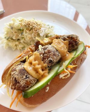 Vegan hot-dog with "meatballs", mayo, Korean-style carrots, caramelized onions, potato pie, cucumber and spicy apricot ice cream. at Aygi in Yerevan