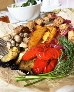 The part of Haykakan lunch: fried, baked and grilled vegetables: eggplants, bell peppers, potatoes, and champignons + homemade pickles
 at Aygi in Yerevan