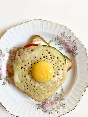 The best vegan imitation yolk, or rather fried egg! Served on a piece of bread with aioli sauce, cucumber and tomato slices. Highly recommend! at Aygi in Yerevan