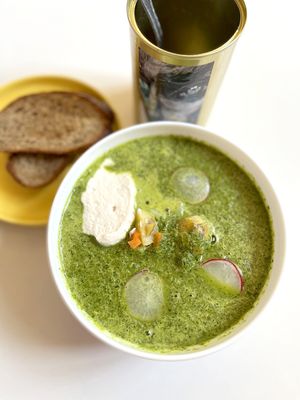 Vegan Okroshka (Russian summer cold soup) with hearty green "broth", homemade sausages, cucumbers, radish, boiled potatoes, boiled carrots, and cashew sauce  at Aygi in Yerevan