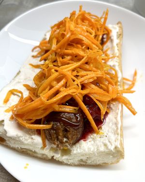 Vegan sausage with lingonberry sauce. Delivered as a semi-finished product, I fried it and made hot-dog with Korean carrots and homemade cashew sauce. at Aygi in Yerevan