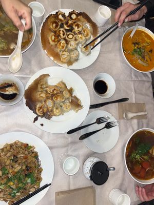 Qi Shan Minced Noodles (bottom left), Laksa Noodles Soup (top right) and dumplings  at Joyve Cafe in Auckland