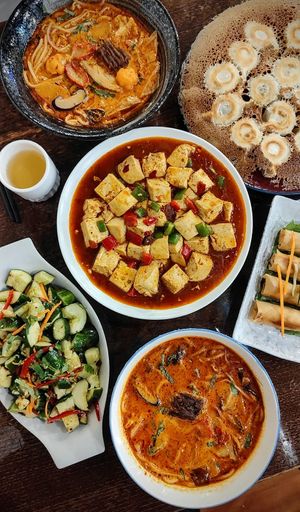 Bottom left- Chinese smashed cucumber salad
Bottom and top left- Laksa
Top right- panfried dumpling
right -spring roll
center- mapo tofu at Joyve Cafe in Auckland
