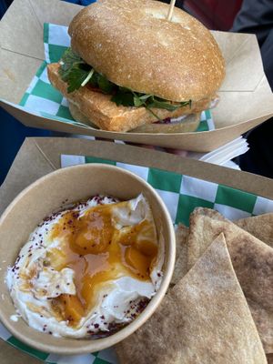 tofu sammy and labneh and pita on the bottom   at Mishmish Souq in Oakland