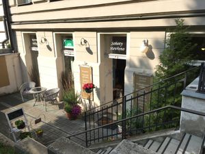 Outside (some places to sit) at Cesmina Bio in Prague