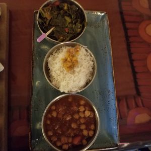 Potjie Inspired entree with Chickpea Wat, collard greens, and basmati white rice. Not hot spicy, but delicious. at Sanaa in Lake Buena Vista