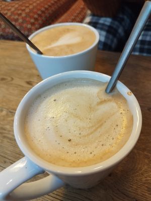 Bigass coffees with oat milk at Green Caffè Nero in Warsaw
