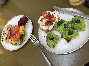 Curried chickpea bagel; toast two ways (tofu cream cheese and pea-guac)  at Morgentau. in Barcelona