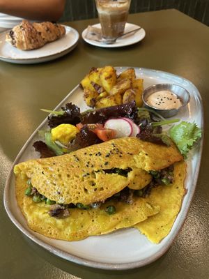 Omellete (in the back chocolat croissant)  at Morgentau. in Barcelona