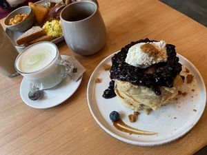 Blueberry pancakes and matcha latte  at Morgentau. in Barcelona
