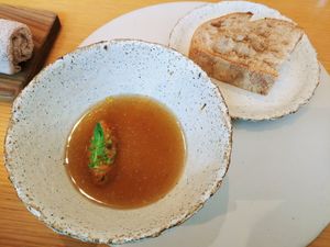 Vegetable soup with a slice of sourdough bread at Legume Seoul in Seoul