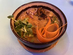 Vegan ramen made with miso and peanut sauce, noodles, soybean sprouts, carrots, vegan protein, onion, mushrooms, pakchoi, spring onion  at Ramen Shifu - Monte Nero in Milan