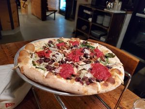 Kalamata Oluves, olives, onion pizza with violife cheese at OTTO in Portsmouth