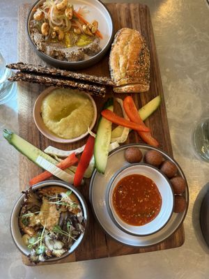 Spread board: mushroom pate (top), leek confit (mid), pine nut & mushroom (bottom left), mochi (bottom right)  at Livbud Cafe in Seattle