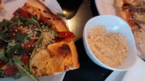 Adding my own cous cous, which had been omitted... at Dough Pizza Kitchen in Manchester