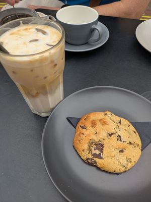 Oat latte and vegan cookie at The Refinery  in Faversham