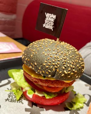 VJFB Cruelty Free Burger: "beeef" on a black/pink bun, cheeze, lettuce, tomato, pickles, VJFB sauce at Vegan Junk Food Bar -  L'Eixample in Barcelona