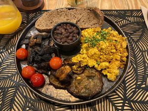 Tofu + nooch scramble, grilled aubergines, tomatoes, mushrooms, toast and black beans. at Look Sharp Cafe Porto | Coworking | Events | Retail in Porto