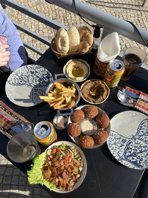 Breads, fries, falafel, houmous, baba gaboush and fattoush salad   at Damasqino in Almada
