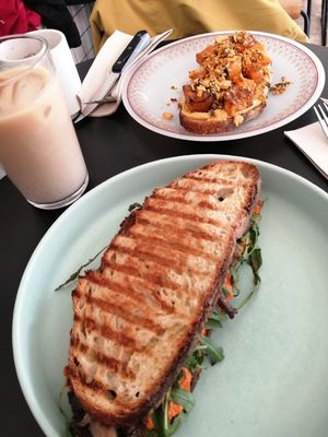 Muhammara sandwich and pumpkin tostada. Iced chai and brew coffee. at Dale Café  in Madrid