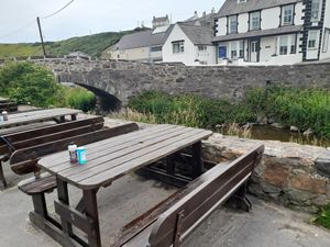 Outside tables at Sblash Fish Bar in Aberdaron