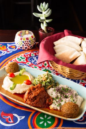 Appetizer sampler - completely vegan
Hummus, tabouli, baba ganoush, falafel, and muhammarra (roasted red pepper dip)

All of this can be ordered individually as well. at Freekeh in San Francisco