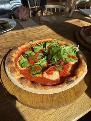 Anacardi - homemade cashew ricotta, caramelised onions, tomatoes, chilli sauce, spinach and olive oil   at The Lost Kitchen in Tiverton