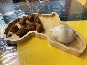 Black eyed pea fritters & ugali  at Yagg Sii Tenn Authentic African Cuisine in Apex