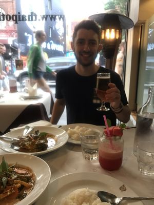 Vegan panang curry front left, bf with his barramundi curry back left at Thai Pothong in Newtown