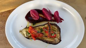Braised eggplant with beetroot reduction and pickled onions.
Eggplant melts in your mouth, onions are the hero of the dish. 
Nice but not exceptional comparing to the rest. at Agriristoro Alla Terra in Castagneto Carducci