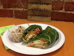 Super veggie made entirely raw vegan/GF on collard wrap with homemade cashew cheese with raw vegan/GF ginger coleslaw with black sesame seeds. at Superfoods Cafe & Market in Mt Airy